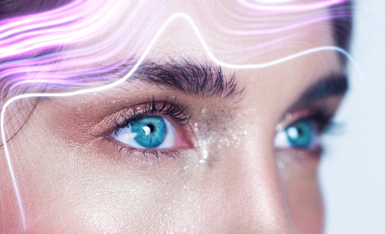 A woman with piercing blue eyes stares out below wavy lines of laser light